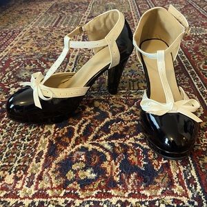 Brand new, never worn retro pinup black and white t-strap heels!